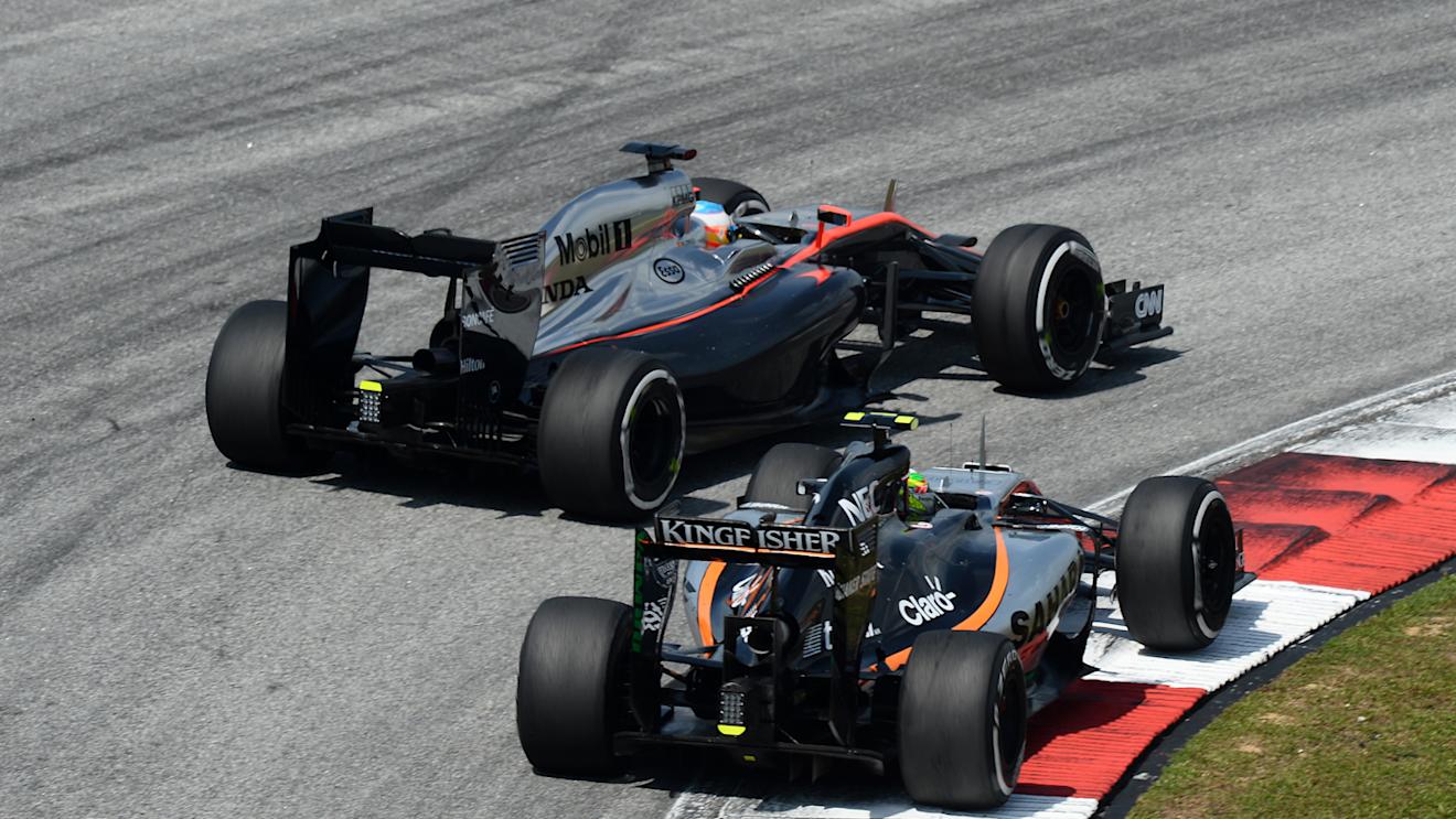 Fernando Alonso (ESP) McLaren MP4-30 and Sergio Perez (MEX) Force India VJM08 bttle at Formula One World Championship, Rd2, Malaysian Grand Prix, Race, Sepang, Malaysia, Sunday 29 March 2015. © Sutton Motorsport Images