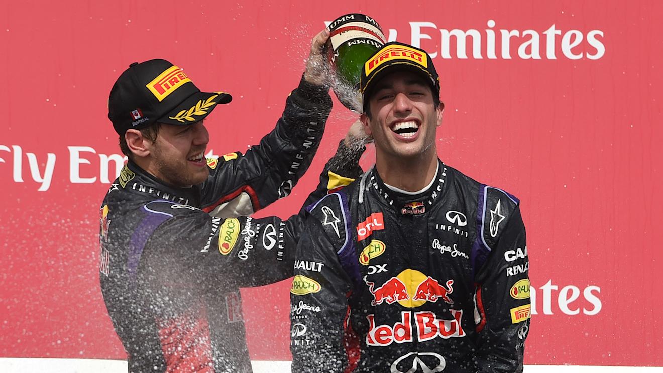 (L to R): Sebastian Vettel (GER) Red Bull Racing RB10 and race winner Daniel Ricciardo (AUS) Red Bull Racing celebrate on the podium with the champagne.
Formula One World Championship, Rd7, Canadian Grand Prix, Race Day, Montreal, Canada, Sunday 8 June 2014.

BEST IMAGE © Sutton Motorsport Images