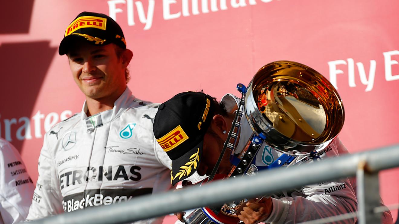 Nico Rosberg (GER) Mercedes AMG F1 and Lewis Hamilton (GBR) Mercedes AMG F1 celebrate on the podium. Formula One World Championship, Rd17, United States Grand Prix, Race, Austin, Texas, USA, Sunday, 2 November 2014