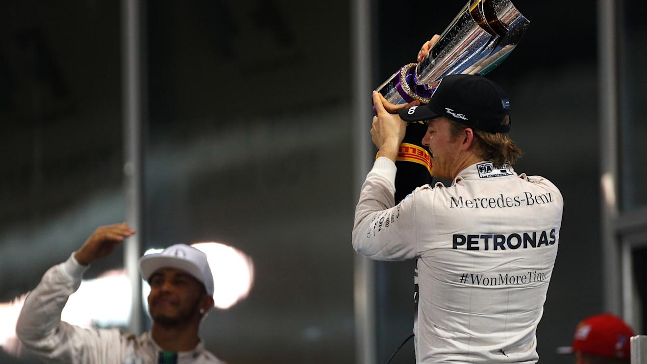 Race winner Nico Rosberg (GER) Mercedes AMG F1 and Lewis Hamilton (GBR) Mercedes AMG F1 celebrates with the trophy at Formula One World Championship, Rd19, Abu Dhabi Grand Prix, Race, Yas Marina Circuit, Abu Dhabi, UAE, Sunday 29 November 2015. © Sutton Motorsport Images