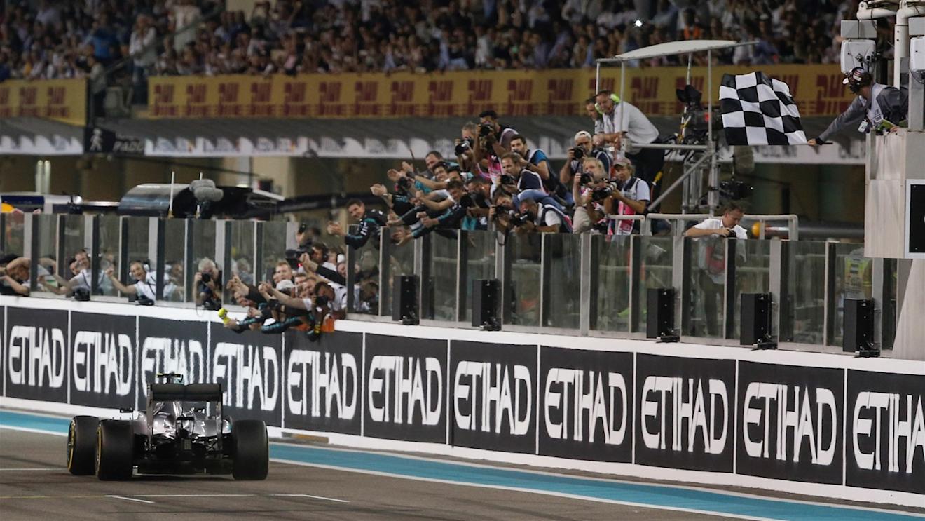 Race winner Nico Rosberg (GER) Mercedes AMG F1 W06 takes the chequered flag at Formula One World Championship, Rd19, Abu Dhabi Grand Prix, Race, Yas Marina Circuit, Abu Dhabi, UAE, Sunday 29 November 2015. © Sutton Motorsport Images