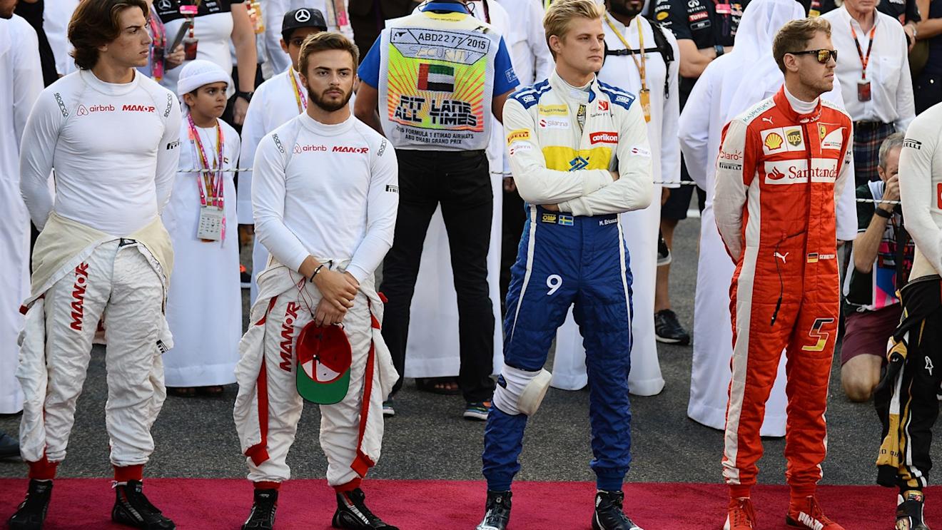 Roberto Merhi (ESP) Marussia, Will Stevens (GBR) Marussia, Marcus Ericsson (SWE) Sauber and Sebastian Vettel (GER) Ferrari on the grid at Formula One World Championship, Rd19, Abu Dhabi Grand Prix, Race, Yas Marina Circuit, Abu Dhabi, UAE, Sunday 29 November 2015. © Sutton Motorsport Images