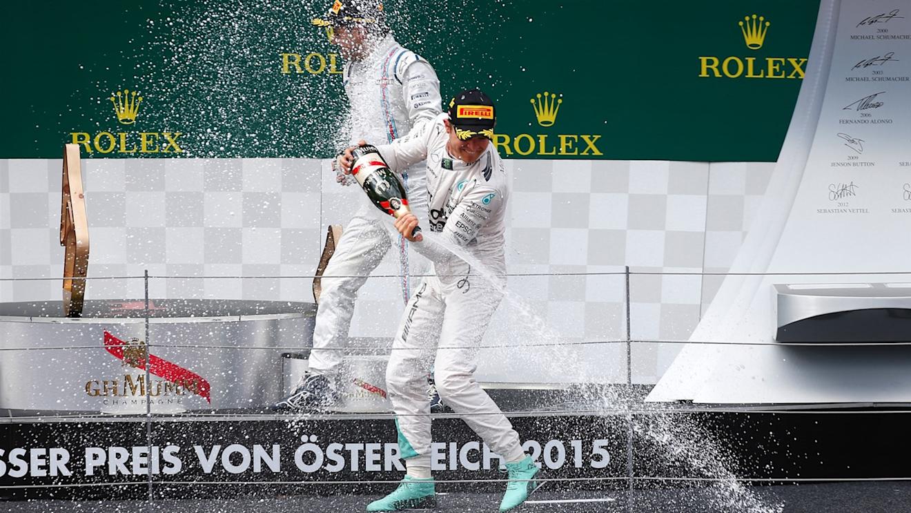 Race winner Nico Rosberg (GER) Mercedes AMG F1 celebrates with Lewis Hamilton (GBR) Mercedes AMG F1 and champagne on the podium at Formula One World Championship, Rd8, Austrian Grand Prix, Race, Spielberg, Austria, Sunday 21 June 2015. © Sutton Motorsport Images