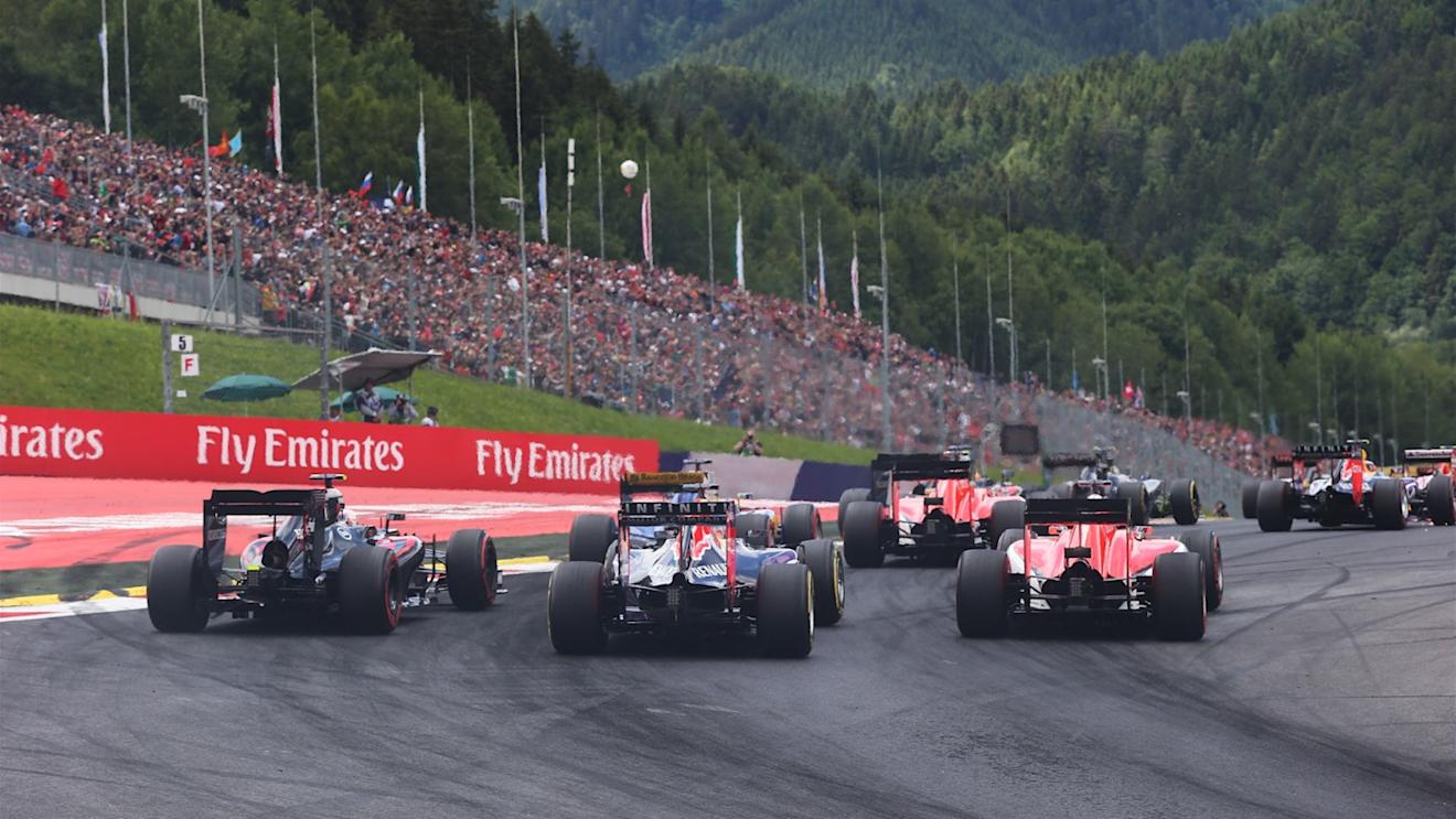 Jenson Button (GBR) McLaren MP4-30, Daniel Ricciardo (AUS) Red Bull Racing RB11 and Will Stevens (GBR) Manor GP at the start of the race at Formula One World Championship, Rd8, Austrian Grand Prix, Race, Spielberg, Austria, Sunday 21 June 2015. © Sutton Motorsport Images