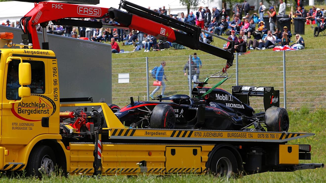 The car of race retiree Fernando Alonso (ESP) McLaren MP4-30 is recovered at Formula One World Championship, Rd8, Austrian Grand Prix, Race, Spielberg, Austria, Sunday 21 June 2015. © Sutton Motorsport Images