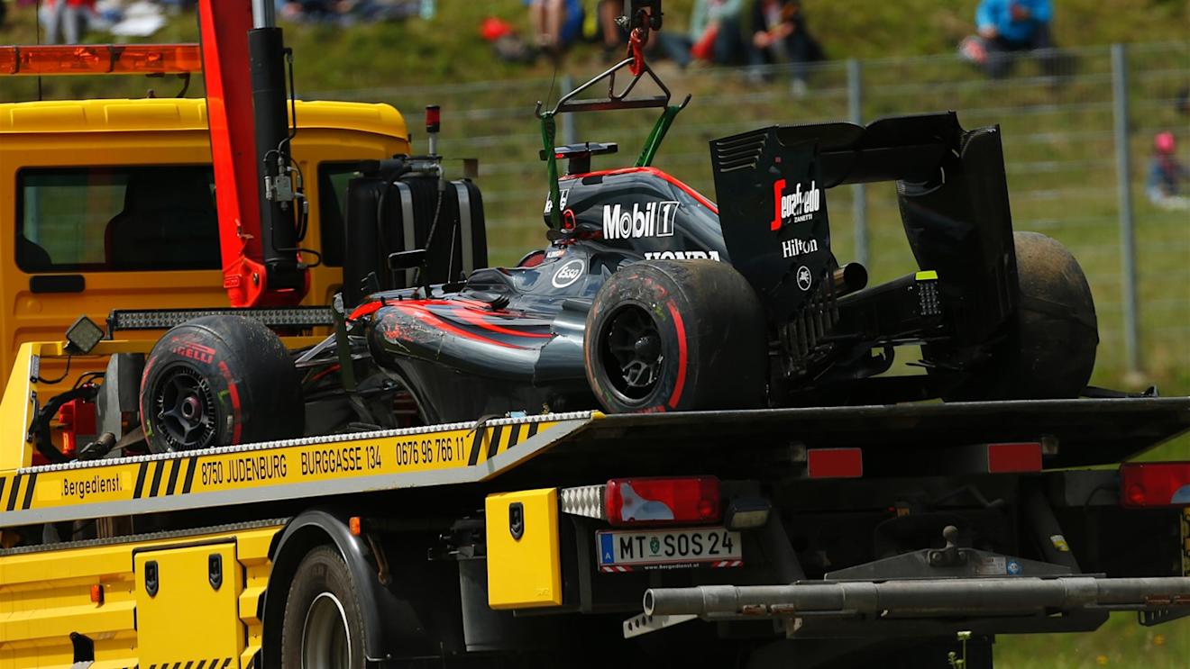 The car of race retiree Fernando Alonso (ESP) McLaren MP4-30 is recovered at Formula One World Championship, Rd8, Austrian Grand Prix, Race, Spielberg, Austria, Sunday 21 June 2015. © Sutton Motorsport Images