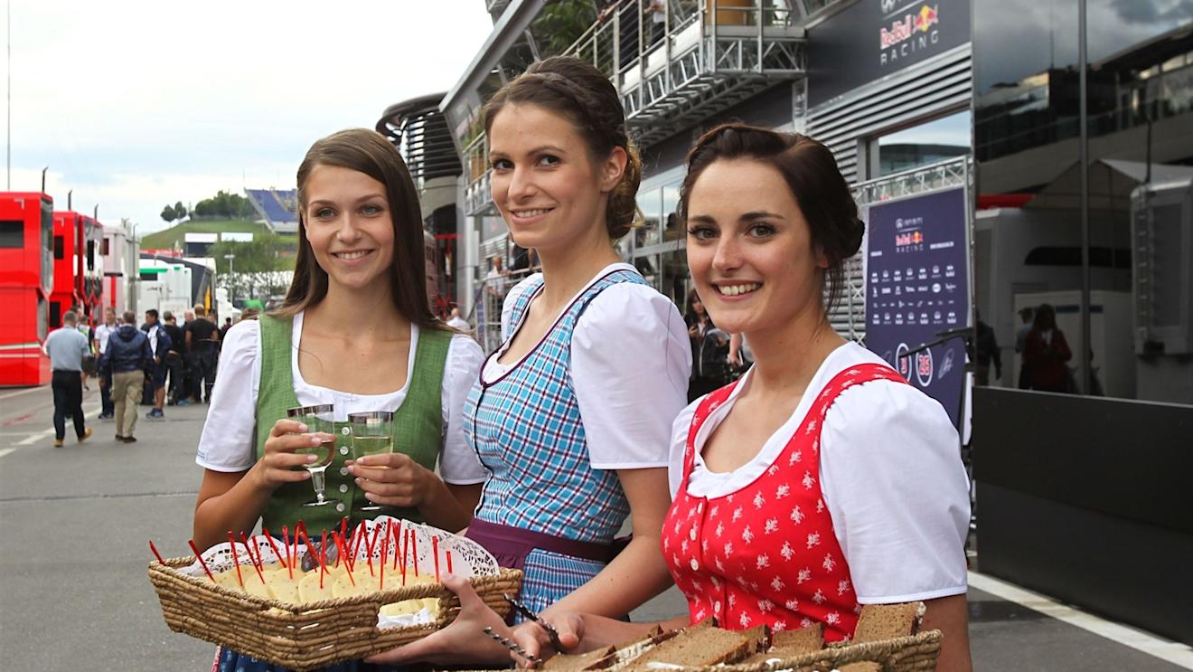 Austrian girls in traditional dress serving food in the paddock at Formula One World Championship, Rd8, Austrian Grand Prix, Preparations, Spielberg, Austria, Thursday 18 June 2015. © Sutton Motorsport Images