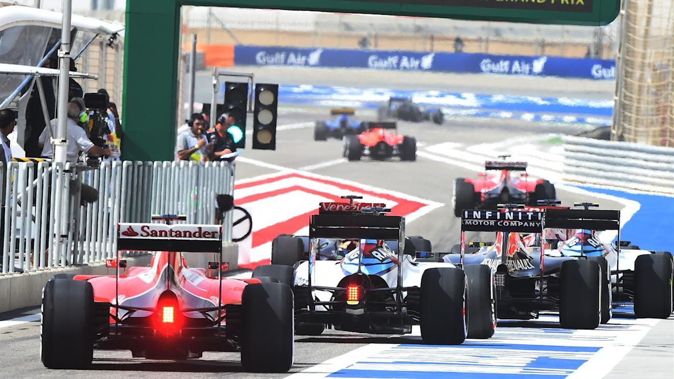 Cars leave the pitlane for the start of FP1 practise at Formula One World Championship, Rd4, Bahrain Grand Prix Practice, Bahrain International Circuit, Sakhir, Bahrain, Friday 17 April 2015. © Sutton Motorsport Images