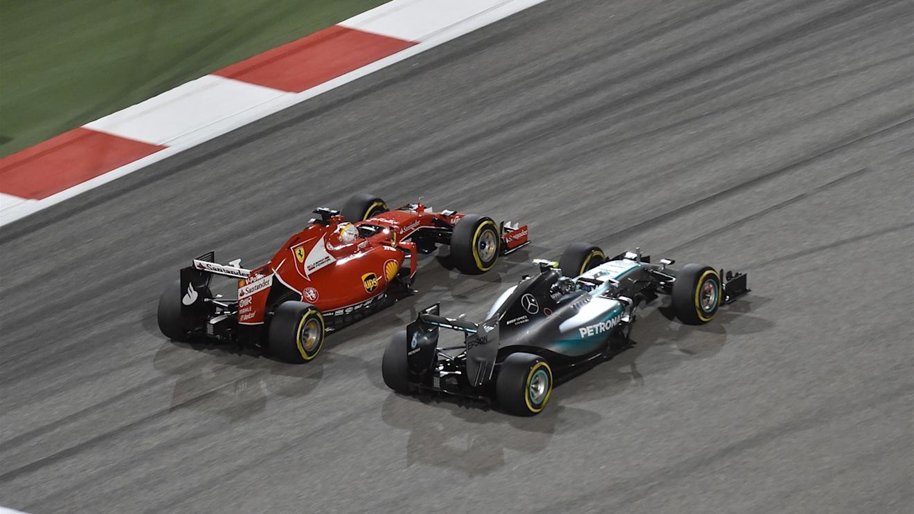 Sebastian Vettel (GER) Ferrari SF15-T and Nico Rosberg (GER) Mercedes AMG F1 W06 at Formula One World Championship, Rd4, Bahrain Grand Prix Race, Bahrain International Circuit, Sakhir, Bahrain, Sunday 19  April 2015. © Sutton Motorsport Images