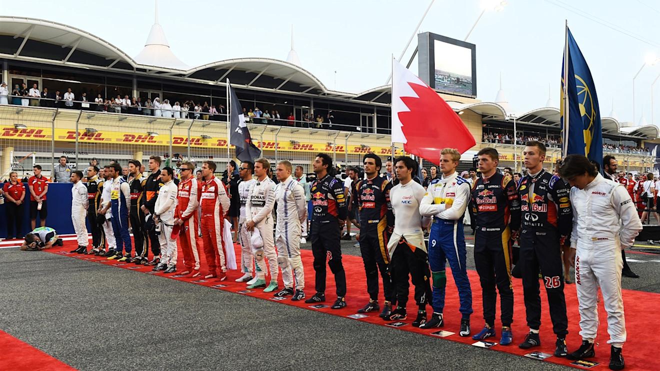 Drivers observe the National Anthem on the grid at Formula One World Championship, Rd4, Bahrain Grand Prix Race, Bahrain International Circuit, Sakhir, Bahrain, Sunday 19  April 2015. © Sutton Motorsport Images