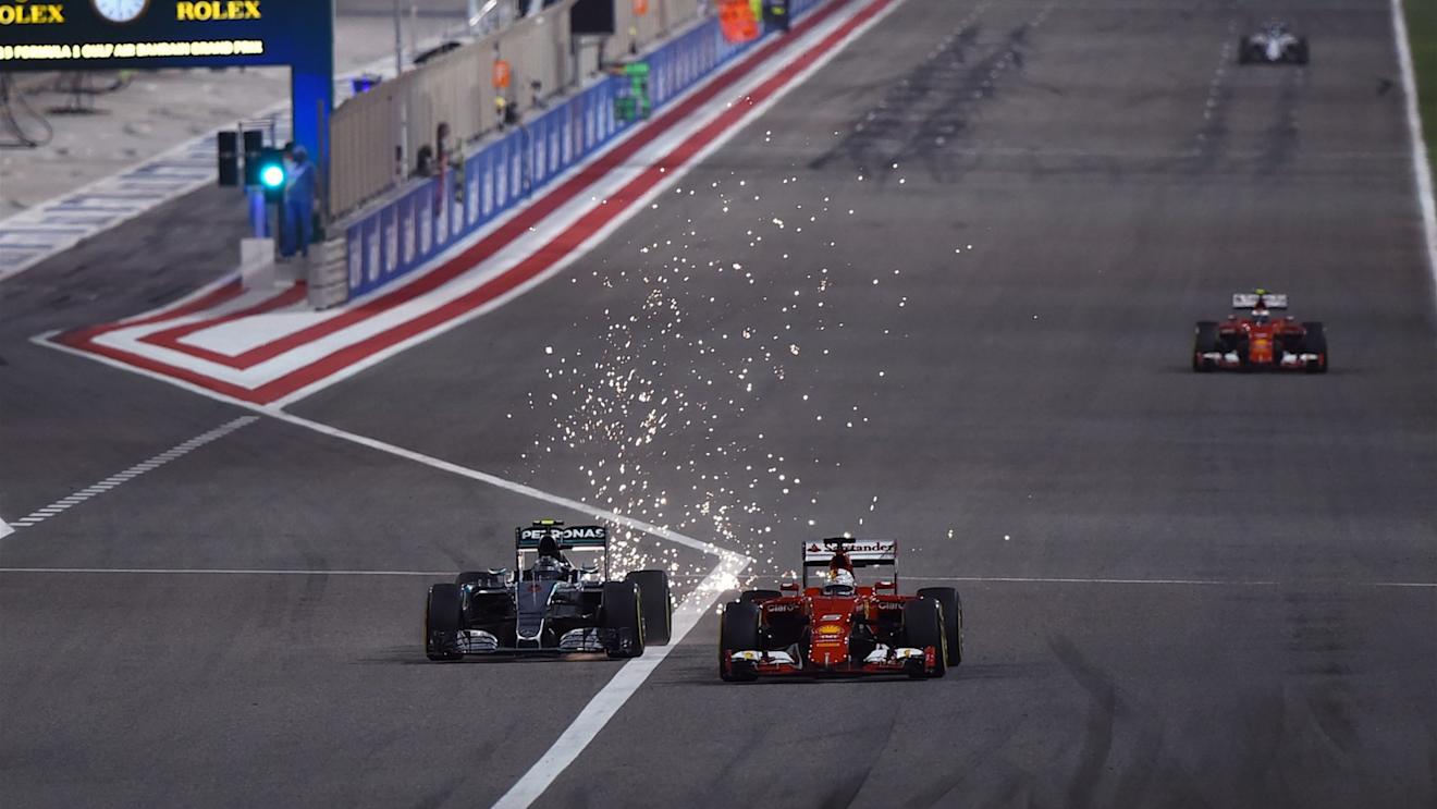 Nico Rosberg (GER) Mercedes AMG F1 W06 and Sebastian Vettel (GER) Ferrari SF15-T battle at Formula One World Championship, Rd4, Bahrain Grand Prix Race, Bahrain International Circuit, Sakhir, Bahrain, Sunday 19  April 2015. © Sutton Motorsport Images