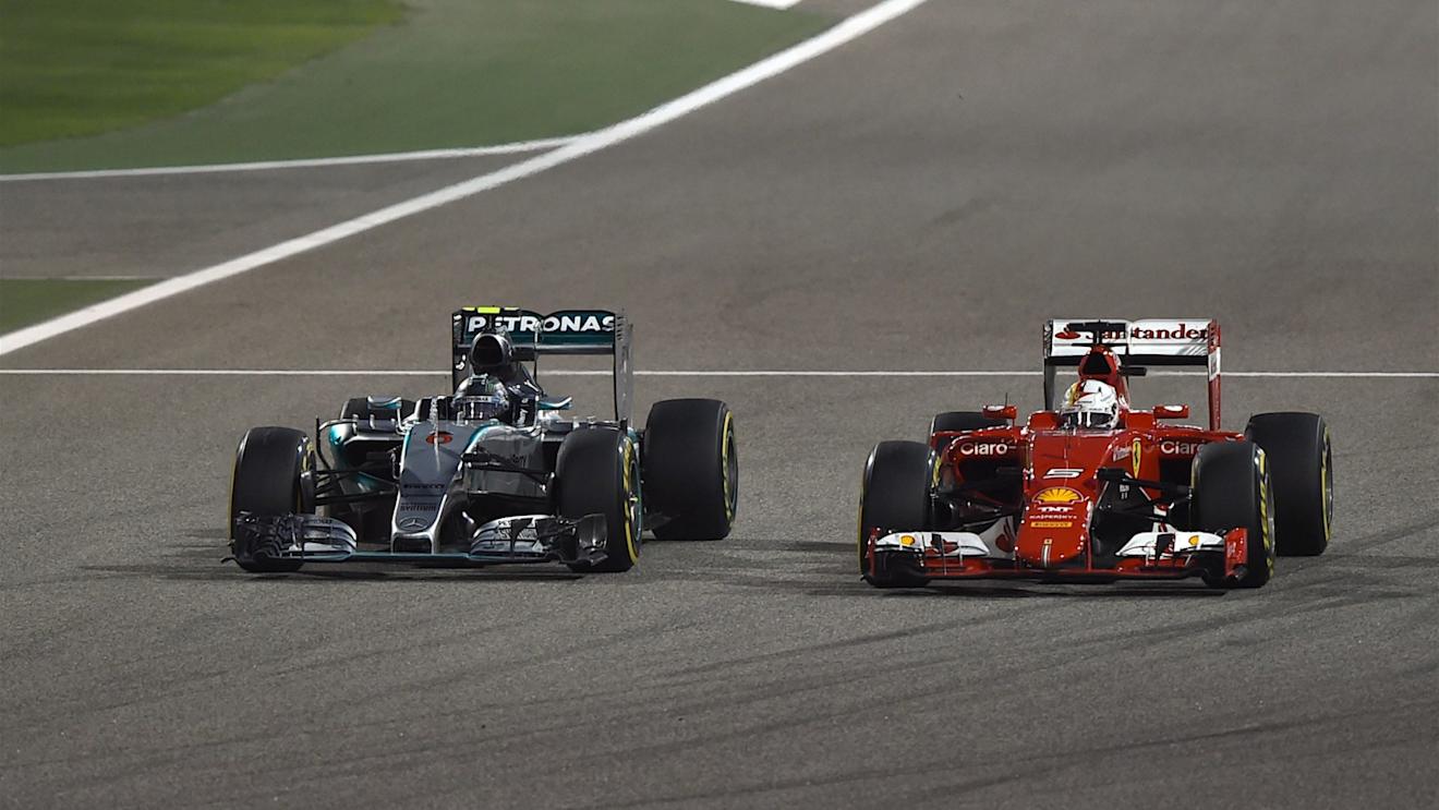 Nico Rosberg (GER) Mercedes AMG F1 W06 and Sebastian Vettel (GER) Ferrari SF15-T battle at Formula One World Championship, Rd4, Bahrain Grand Prix Race, Bahrain International Circuit, Sakhir, Bahrain, Sunday 19  April 2015. © Sutton Motorsport Images
