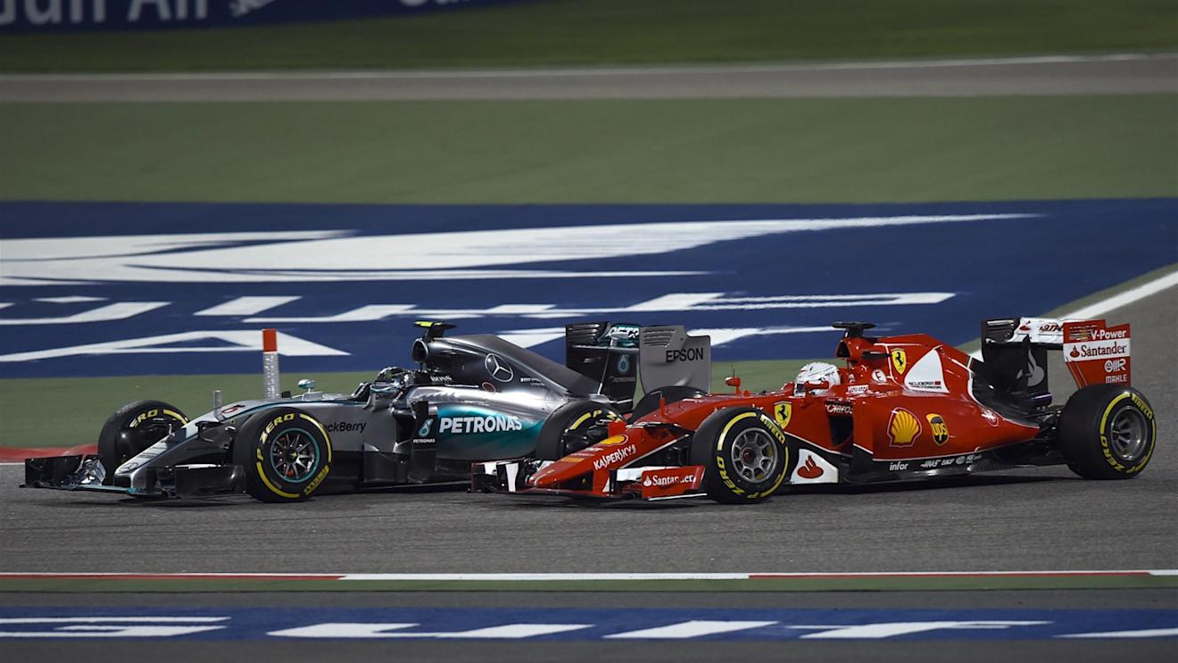 Nico Rosberg (GER) Mercedes AMG F1 W06 and Sebastian Vettel (GER) Ferrari SF15-T battle at Formula One World Championship, Rd4, Bahrain Grand Prix Race, Bahrain International Circuit, Sakhir, Bahrain, Sunday 19  April 2015. © Sutton Motorsport Images