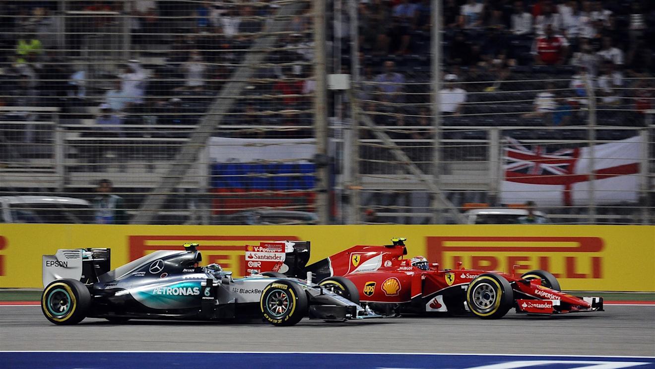 Nico Rosberg (GER) Mercedes AMG F1 W06 and Kimi Raikkonen (FIN) Ferrari SF15-T battle at Formula One World Championship, Rd4, Bahrain Grand Prix Race, Bahrain International Circuit, Sakhir, Bahrain, Sunday 19  April 2015. © Sutton Motorsport Images