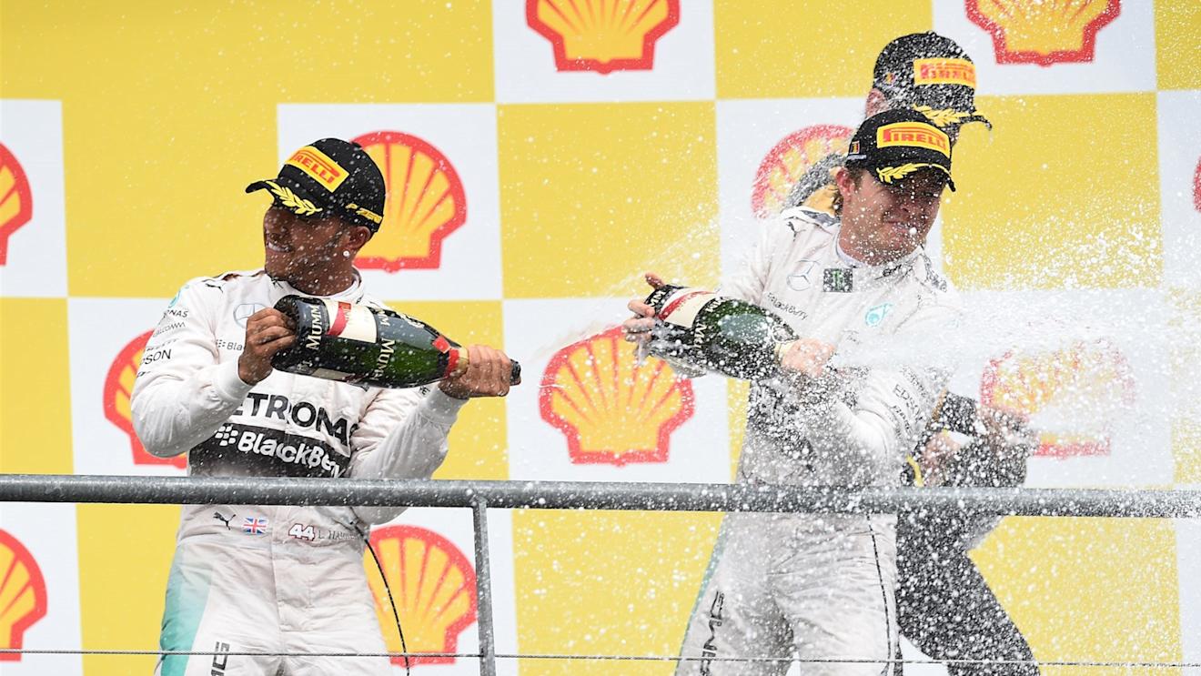 Race winner Lewis Hamilton (GBR) Mercedes AMG F1 and Nico Rosberg (GER) Mercedes AMG F1 celebrate on the podium with the champagne at Formula One World Championship, Rd11, Belgian Grand Prix, Race, Spa Francorchamps, Belgium, Sunday 23 August 2015. © Sutton Motorsport Images