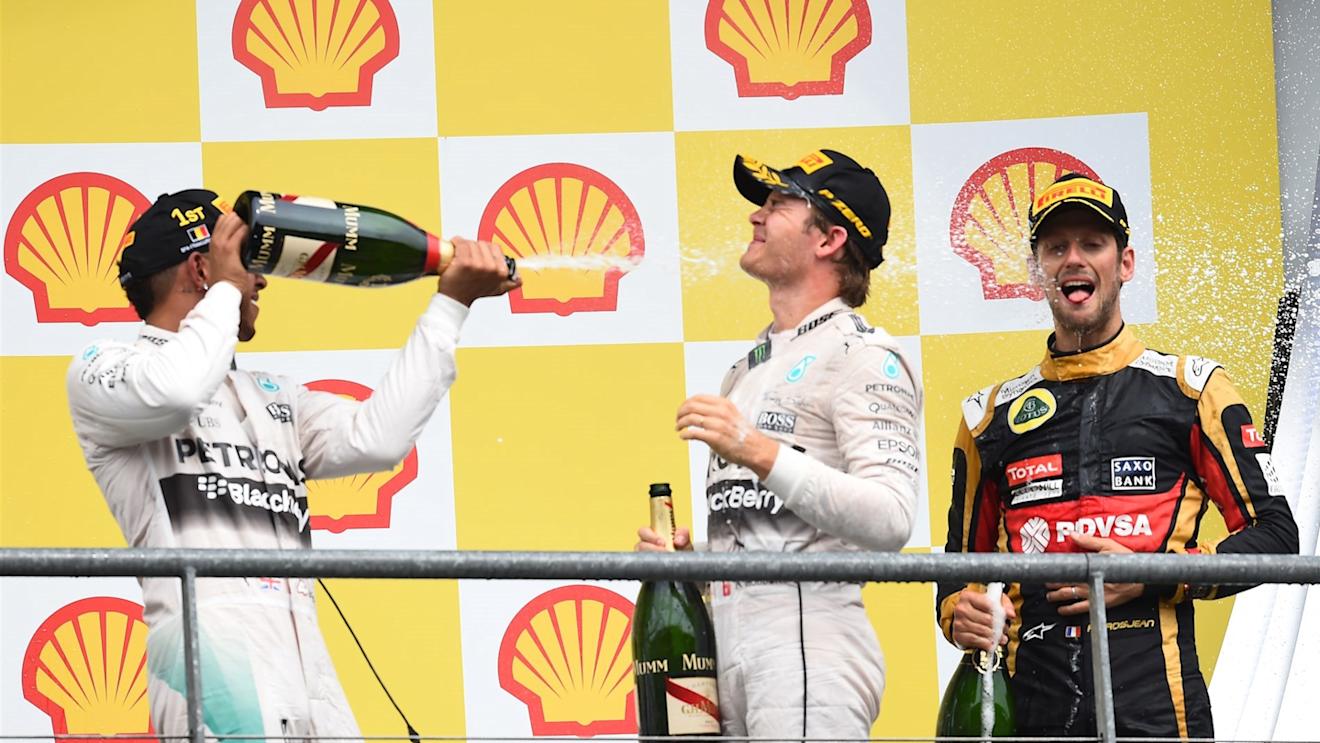 Race winner Lewis Hamilton (GBR) Mercedes AMG F1,  Nico Rosberg (GER) Mercedes AMG F1 and Romain Grosjean (FRA) Lotus F1 celebrate on the podium with the champagne at Formula One World Championship, Rd11, Belgian Grand Prix, Race, Spa Francorchamps, Belgium, Sunday 23 August 2015. © Sutton Motorsport Images