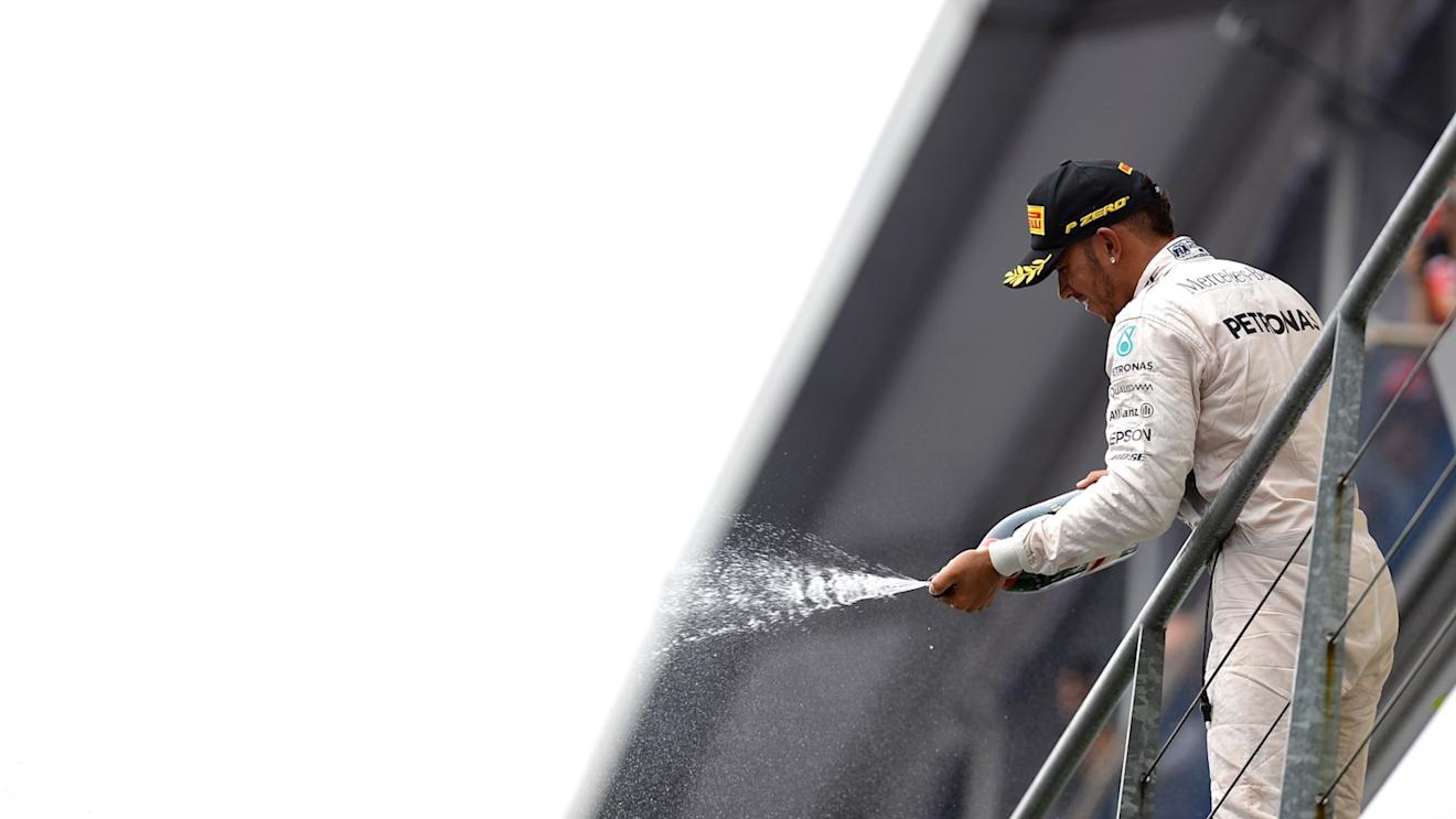 Race winner Lewis Hamilton (GBR) Mercedes AMG F1 celebrates with the champagne on the podium at Formula One World Championship, Rd11, Belgian Grand Prix, Race, Spa Francorchamps, Belgium, Sunday 23 August 2015. © Sutton Motorsport Images