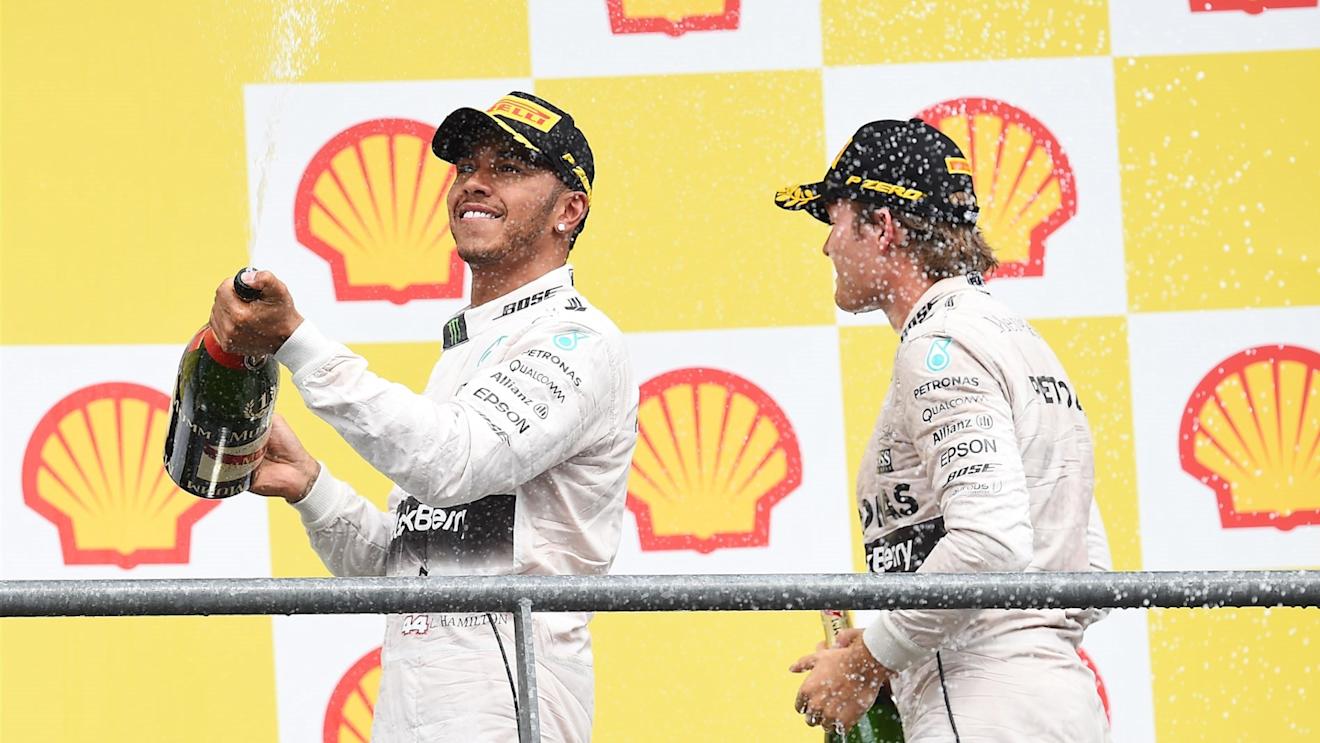 Lewis Hamilton (GBR) Mercedes AMG F1 and Nico Rosberg (GER) Mercedes AMG F1 celebrate on the podium with the champagne at Formula One World Championship, Rd11, Belgian Grand Prix, Race, Spa Francorchamps, Belgium, Sunday 23 August 2015. © Sutton Motorsport Images
