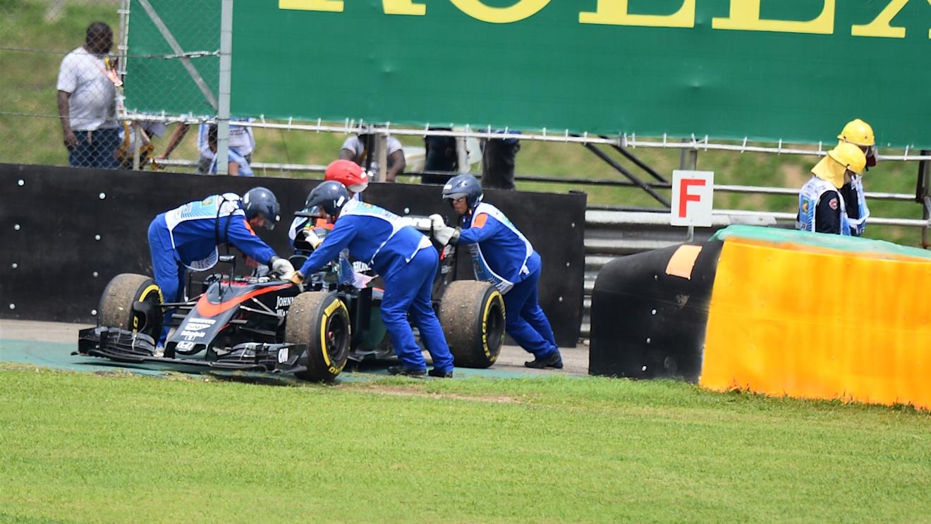 The car of Fernando Alonso (ESP) McLaren MP4-30 is recovered after stopping on track in Q1 at Formula One World Championship, Rd18, Brazilian Grand Prix, Qualifying, Interlagos, Sao Paulo, Brazil, Saturday 14 November 2015. © Sutton Motorsport Images