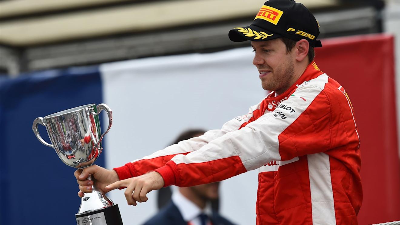 Sebastian Vettel (GER) Ferrari celebrates on the podium with the trophy at Formula One World Championship, Rd18, Brazilian Grand Prix, Race, Interlagos, Sao Paulo, Brazil, Sunday 15 November 2015. © Sutton Motorsport Images