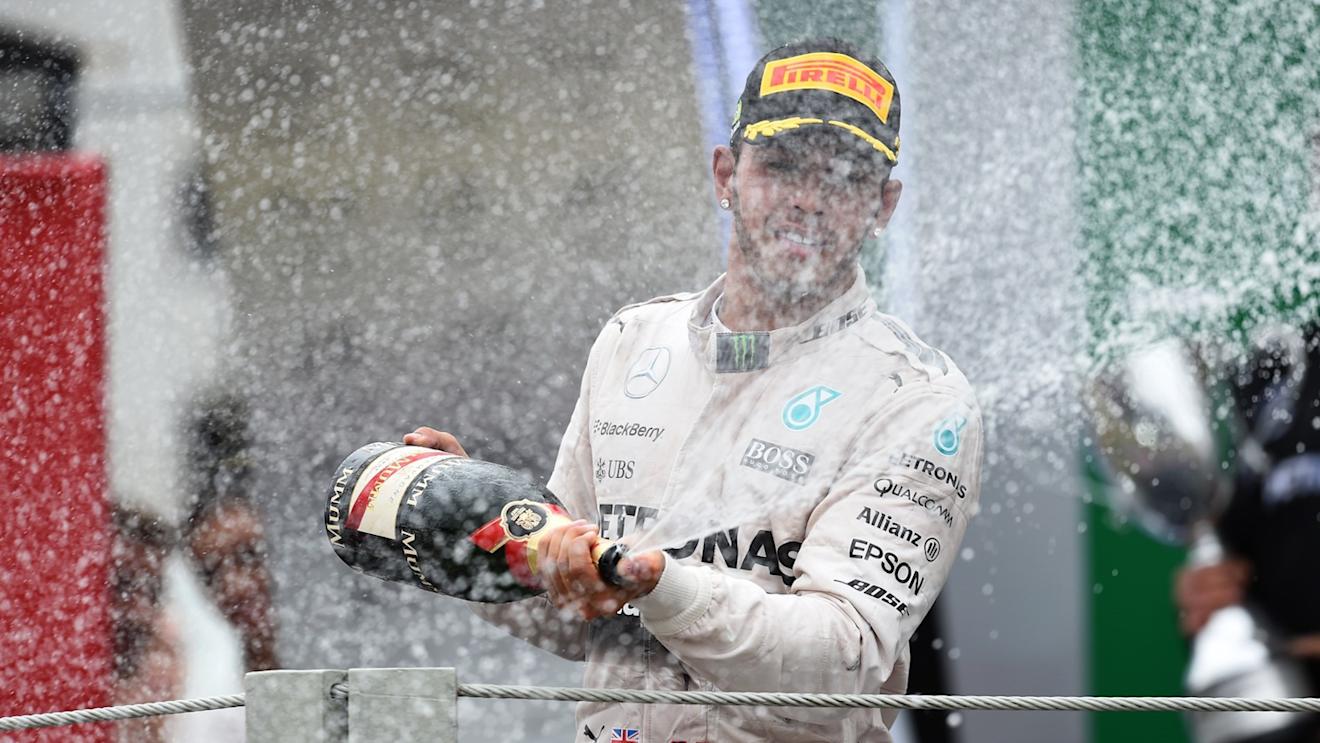 Lewis Hamilton (GBR) Mercedes AMG F1 celebrates on the podium with the champagne at Formula One World Championship, Rd18, Brazilian Grand Prix, Race, Interlagos, Sao Paulo, Brazil, Sunday 15 November 2015. © Sutton Motorsport Images
