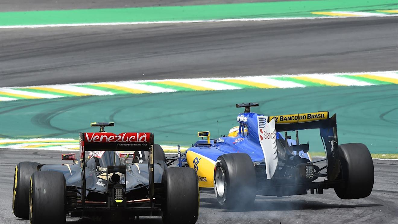 Pastor Maldonado (VEN) Lotus E23 Hybrid and Marcus Ericsson (SWE) Sauber C34 clash at Formula One World Championship, Rd18, Brazilian Grand Prix, Race, Interlagos, Sao Paulo, Brazil, Sunday 15 November 2015. © Sutton Motorsport Images