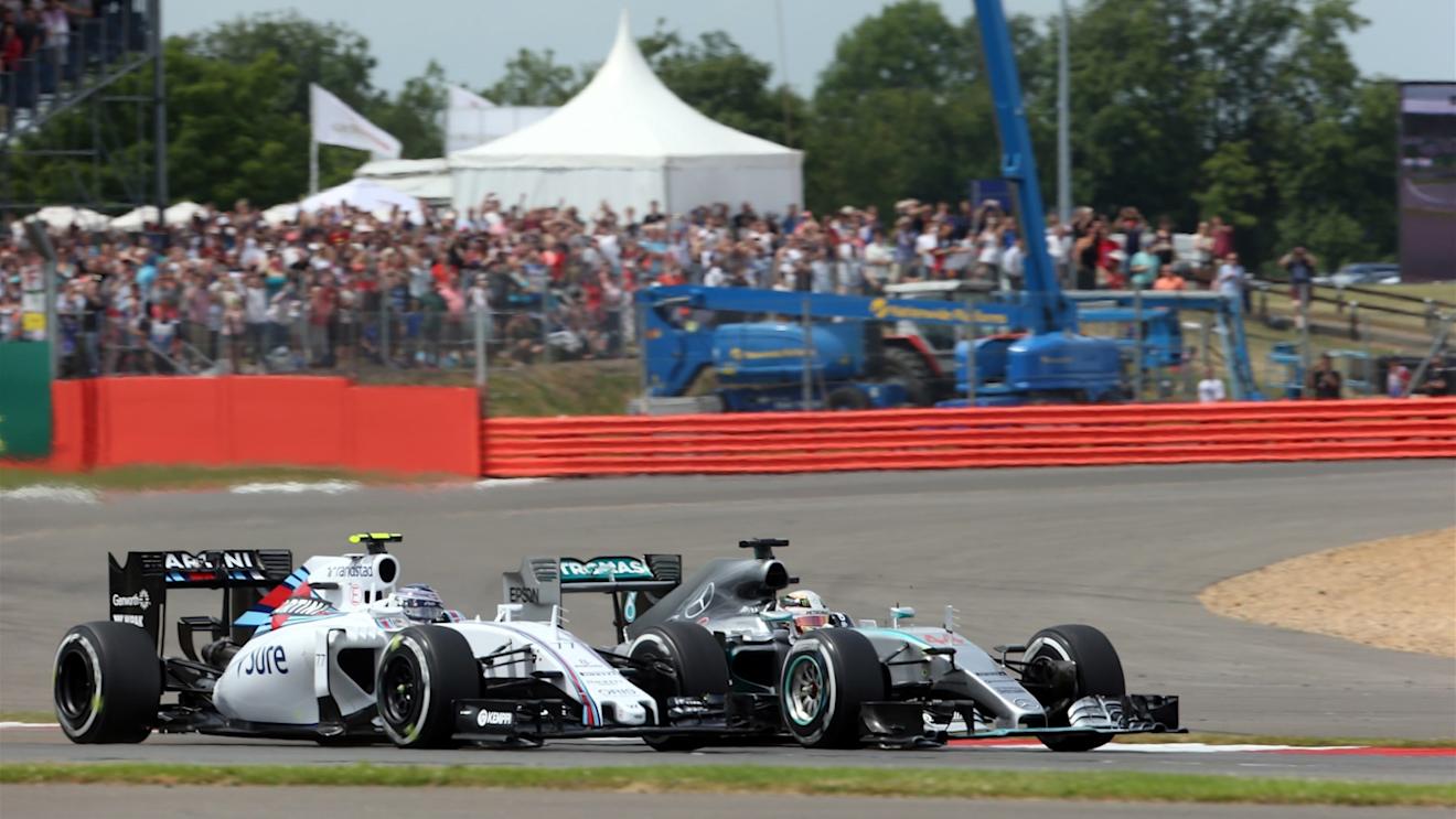 Lewis Hamilton (GBR) Mercedes AMG F1 W06 battles with Valtteri Bottas (FIN) Williams FW37 at the start of the race at Formula One World Championship, Rd9, British Grand Prix, Race, Silverstone, England, Sunday 5 July 2015. © Sutton Motorsport Images