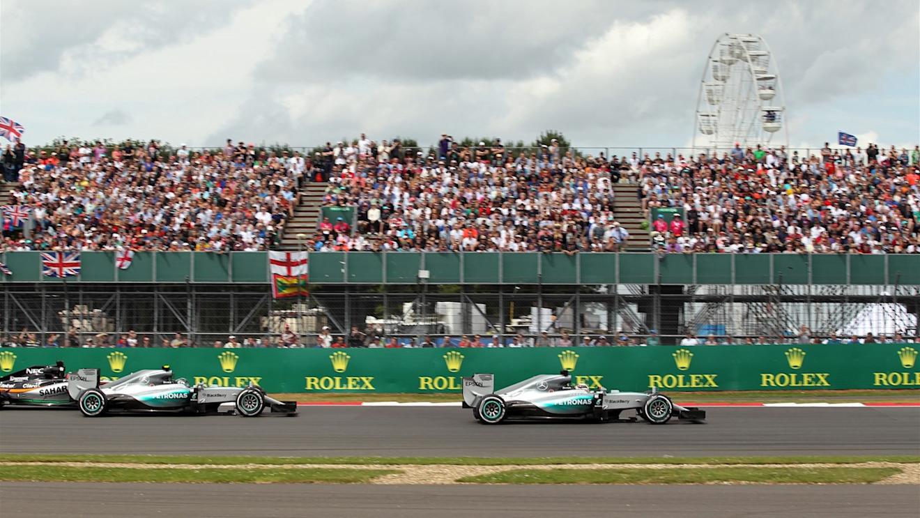 Nico Rosberg (GER) Mercedes AMG F1 W06 battles with Nico Hulkenberg (GER) Force India VJM08 and Lewis Hamilton (GBR) Mercedes AMG F1 W06 at the start of the race at Formula One World Championship, Rd9, British Grand Prix, Race, Silverstone, England, Sunday 5 July 2015. © Sutton Motorsport Images