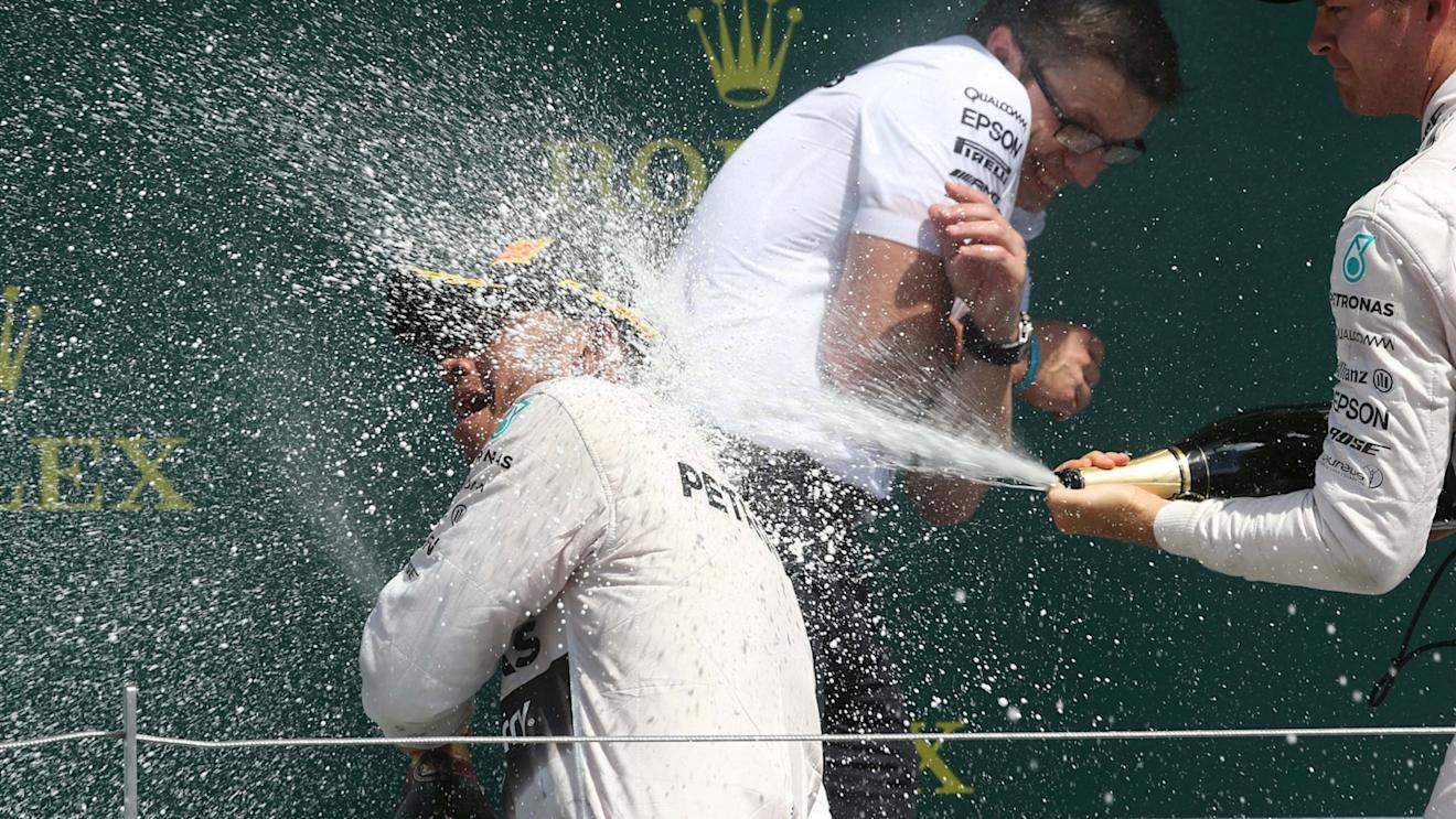Race winner Lewis Hamilton (GBR) Mercedes AMG F1 and 2nd places Nico Rosberg (GER) Mercedes AMG F1 celebrate with the champagne on the podium at Formula One World Championship, Rd9, British Grand Prix, Race, Silverstone, England, Sunday 5 July 2015. © Sutton Motorsport Images