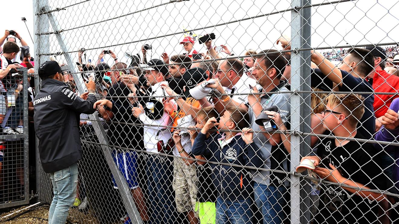 Lewis Hamilton (GBR) Mercedes AMG F1 signs autographs for the fans on the drivers parade at Formula One World Championship, Rd9, British Grand Prix, Race, Silverstone, England, Sunday 5 July 2015. © Sutton Motorsport Images