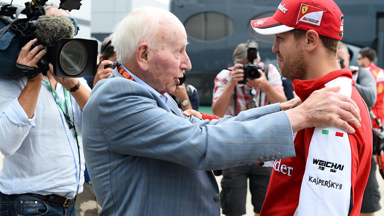 John Surtees (GBR) and Sebastian Vettel (GER) Ferrari at Formula One World Championship, Rd9, British Grand Prix, Race, Silverstone, England, Sunday 5 July 2015. © Sutton Motorsport Images