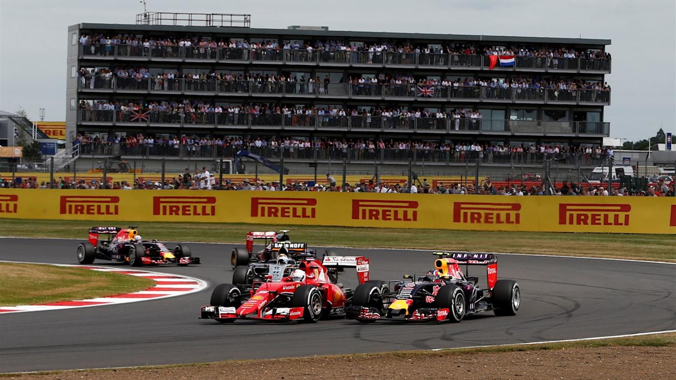Sebastian Vettel (GER) Ferrari SF15-T and Daniil Kvyat (RUS) Red Bull Racing RB11 battle at Formula One World Championship, Rd9, British Grand Prix, Race, Silverstone, England, Sunday 5 July 2015. © Sutton Motorsport Images