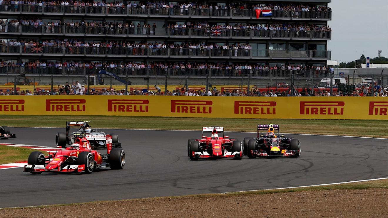 Sebastian Vettel (GER) Ferrari SF15-T and Daniil Kvyat (RUS) Red Bull Racing RB11 battle at Formula One World Championship, Rd9, British Grand Prix, Race, Silverstone, England, Sunday 5 July 2015. © Sutton Motorsport Images