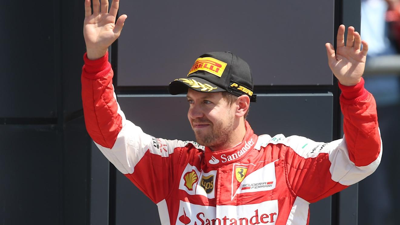 Sebastian Vettel (GER) Ferrari celebrates on the podium at Formula One World Championship, Rd9, British Grand Prix, Race, Silverstone, England, Sunday 5 July 2015. © Sutton Motorsport Images
