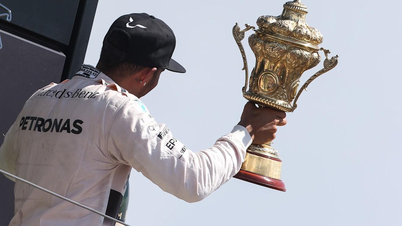 Race winner Lewis Hamilton (GBR) Mercedes AMG F1 celebrates with the trophy on the podium at Formula One World Championship, Rd9, British Grand Prix, Race, Silverstone, England, Sunday 5 July 2015. © Sutton Motorsport Images