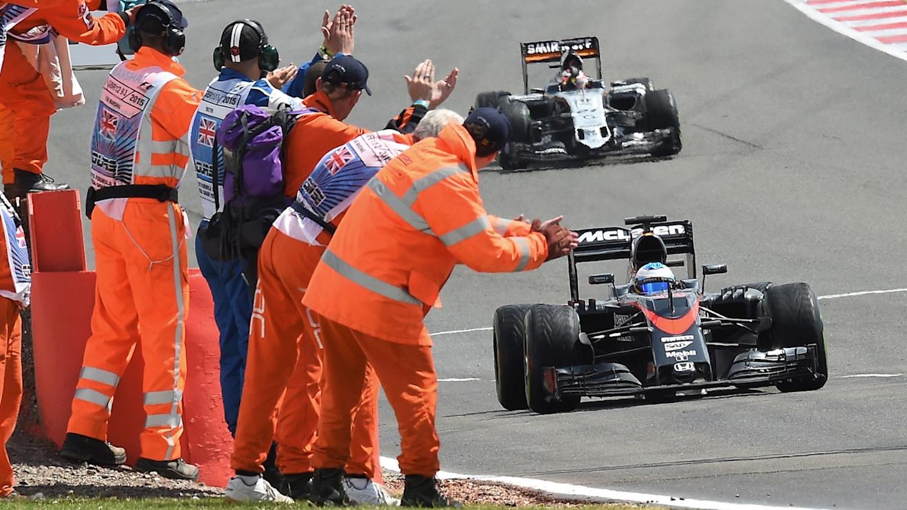 Fernando Alonso (ESP) McLaren MP4-30 passes the marshals at the end of the race at Formula One World Championship, Rd9, British Grand Prix, Race, Silverstone, England, Sunday 5 July 2015. © Sutton Motorsport Images