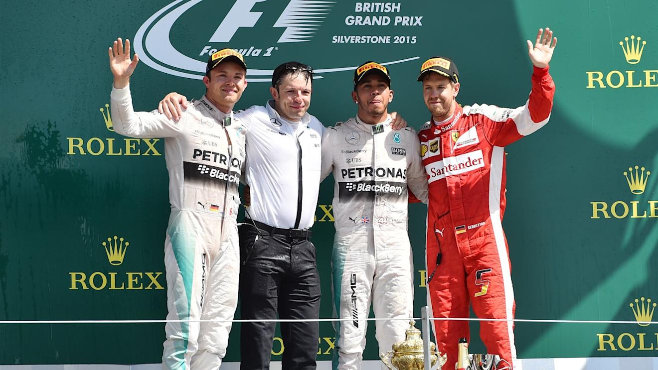 (L to R): Nico Rosberg (GER) Mercedes AMG F1, Peter Bonnington (GBR) Mercedes AMG F1 race engineer, race winner Lewis Hamilton (GBR) Mercedes AMG F1 and Sebastian Vettel (GER) Ferrari celebrate on the podium at Formula One World Championship, Rd9, British Grand Prix, Race, Silverstone, England, Sunday 5 July 2015. © Sutton Motorsport Images