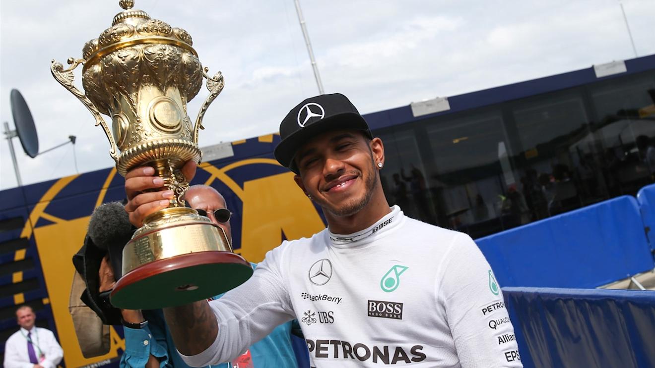 Race winner Lewis Hamilton (GBR) Mercedes AMG F1 celebrates with  trophy at Formula One World Championship, Rd9, British Grand Prix, Race, Silverstone, England, Sunday 5 July 2015. © Sutton Motorsport Images