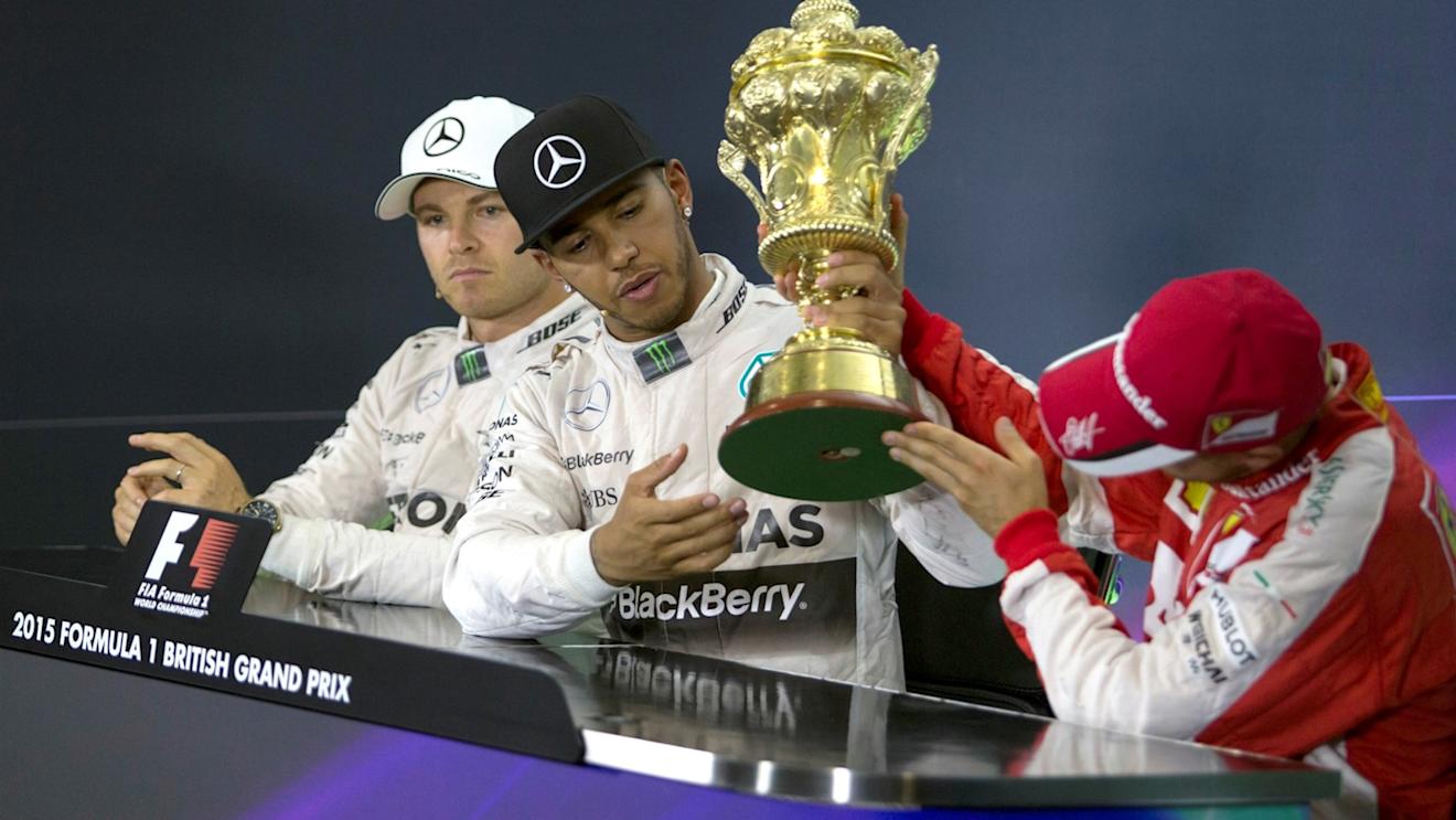 Nico Rosberg (GER) Mercedes AMG F1, Lewis Hamilton (GBR) Mercedes AMG F1 and Sebastian Vettel (GER) Ferrari in the press conference with the trophy   at Formula One World Championship, Rd9, British Grand Prix, Race, Silverstone, England, Sunday 5 July 2015. © Sutton Motorsport Images