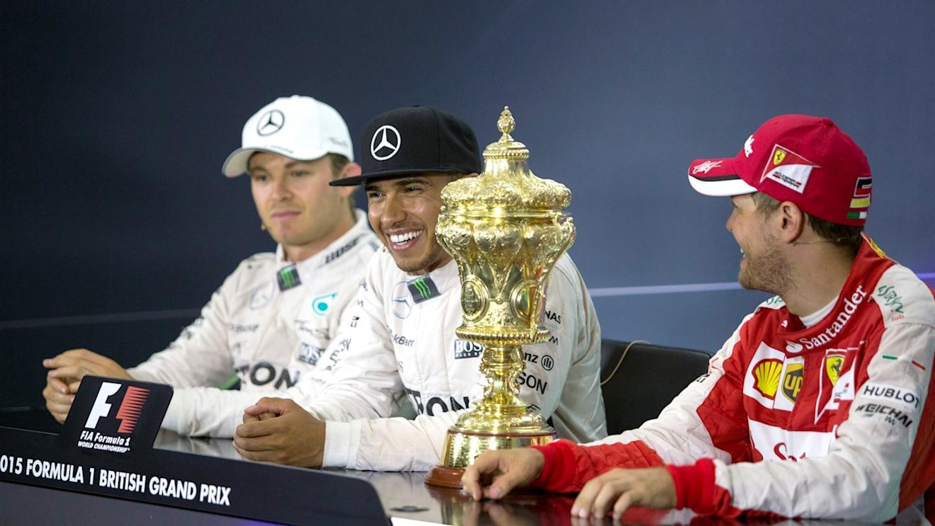 Nico Rosberg (GER) Mercedes AMG F1, Lewis Hamilton (GBR) Mercedes AMG F1 and Sebastian Vettel (GER) Ferrari in the press conference with the trophy   at Formula One World Championship, Rd9, British Grand Prix, Race, Silverstone, England, Sunday 5 July 2015. © Sutton Motorsport Images