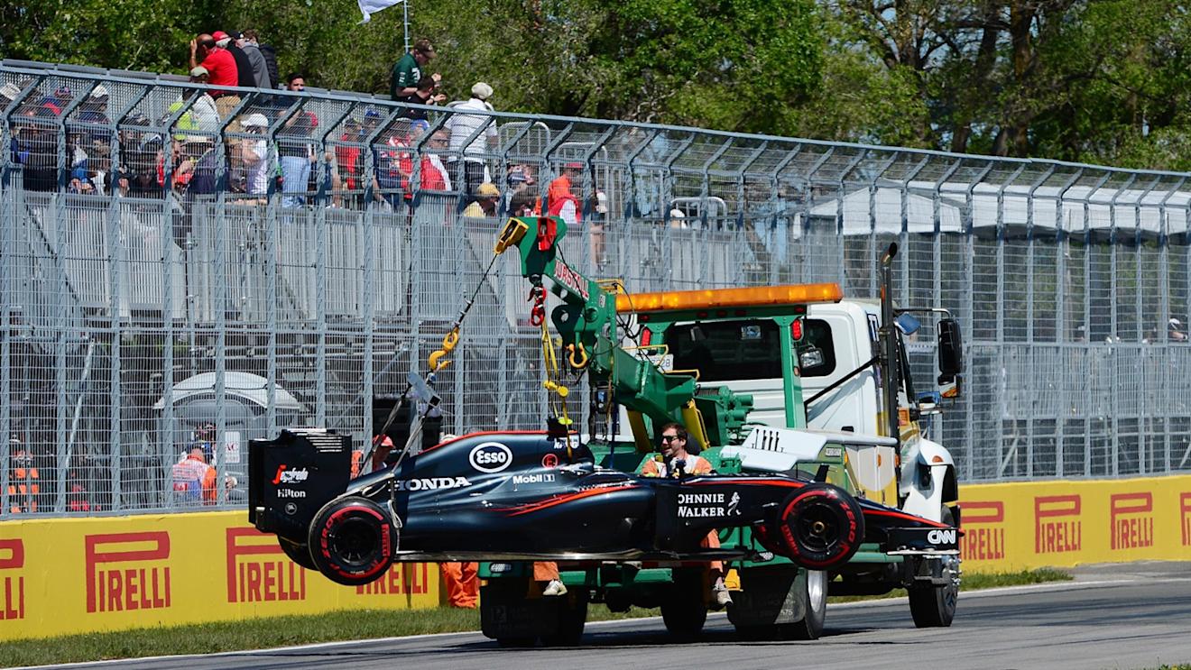 Jenson Button (GBR) McLaren car is recovered to the pits in FP3 at Formula One World Championship, Rd7, Canadian Grand Prix, FP3 Montreal, Canada, Saturday 6 June 2015. © Sutton Motorsport Images