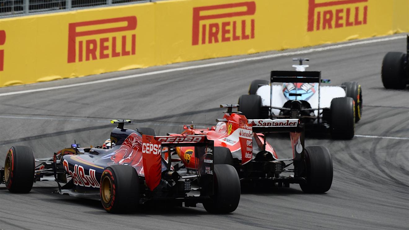 Carlos Sainz jr (ESP) Scuderia Toro Rosso STR10 and Sebastian Vettel (GER) Ferrari SF15-T at Formula One World Championship, Rd7, Canadian Grand Prix, Race, Montreal, Canada, Sunday 7 June 2015. © Sutton Motorsport Images