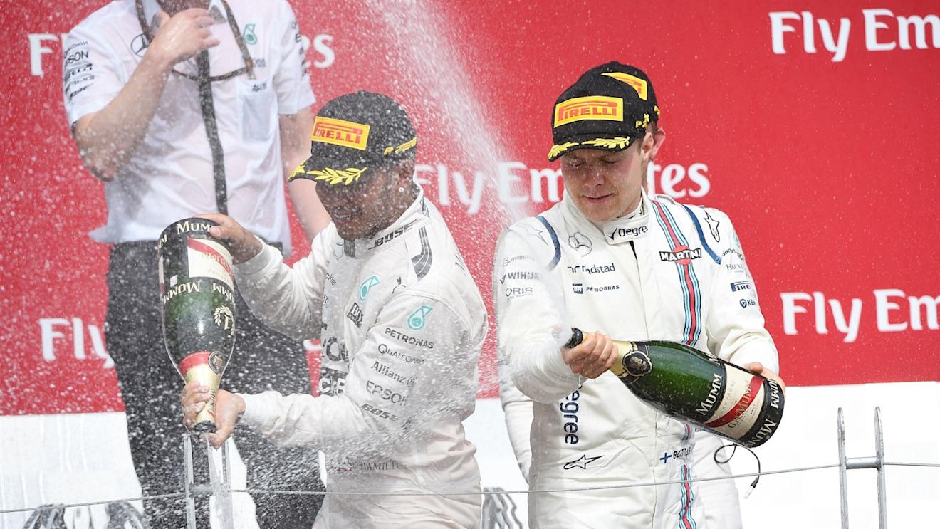 Race winner Lewis Hamilton (GBR) Mercedes AMG F1 and Valtteri Bottas (FIN) Williams  celebrate on the podium with the champagne at Formula One World Championship, Rd7, Canadian Grand Prix, Race, Montreal, Canada, Sunday 7 June 2015. © Sutton Motorsport Images