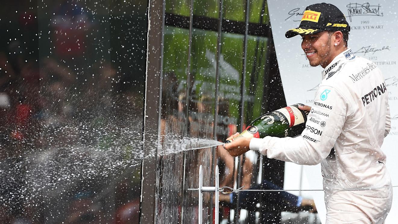 Race winner Lewis Hamilton (GBR) Mercedes AMG F1 celebrates on the podium with the champagne at Formula One World Championship, Rd7, Canadian Grand Prix, Race, Montreal, Canada, Sunday 7 June 2015. © Sutton Motorsport Images