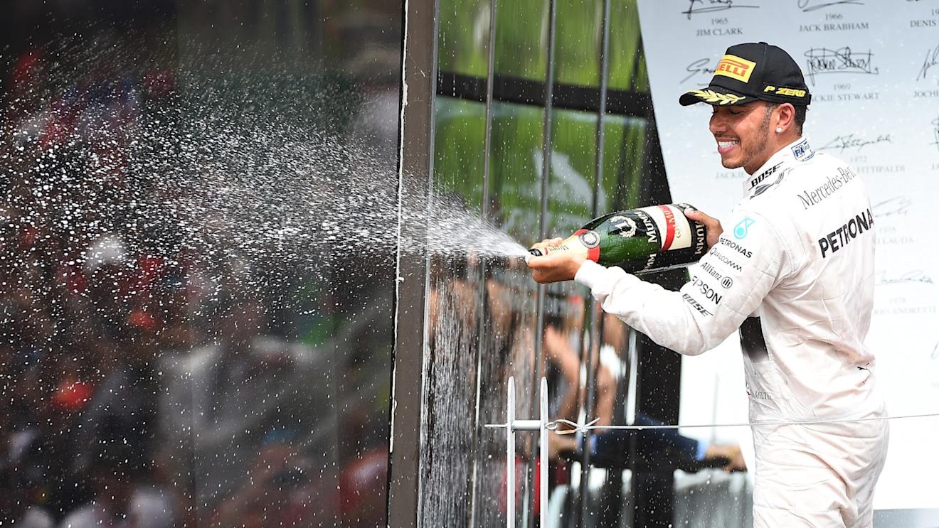 Race winner Lewis Hamilton (GBR) Mercedes AMG F1 celebrates on the podium with the champagne at Formula One World Championship, Rd7, Canadian Grand Prix, Race, Montreal, Canada, Sunday 7 June 2015. © Sutton Motorsport Images