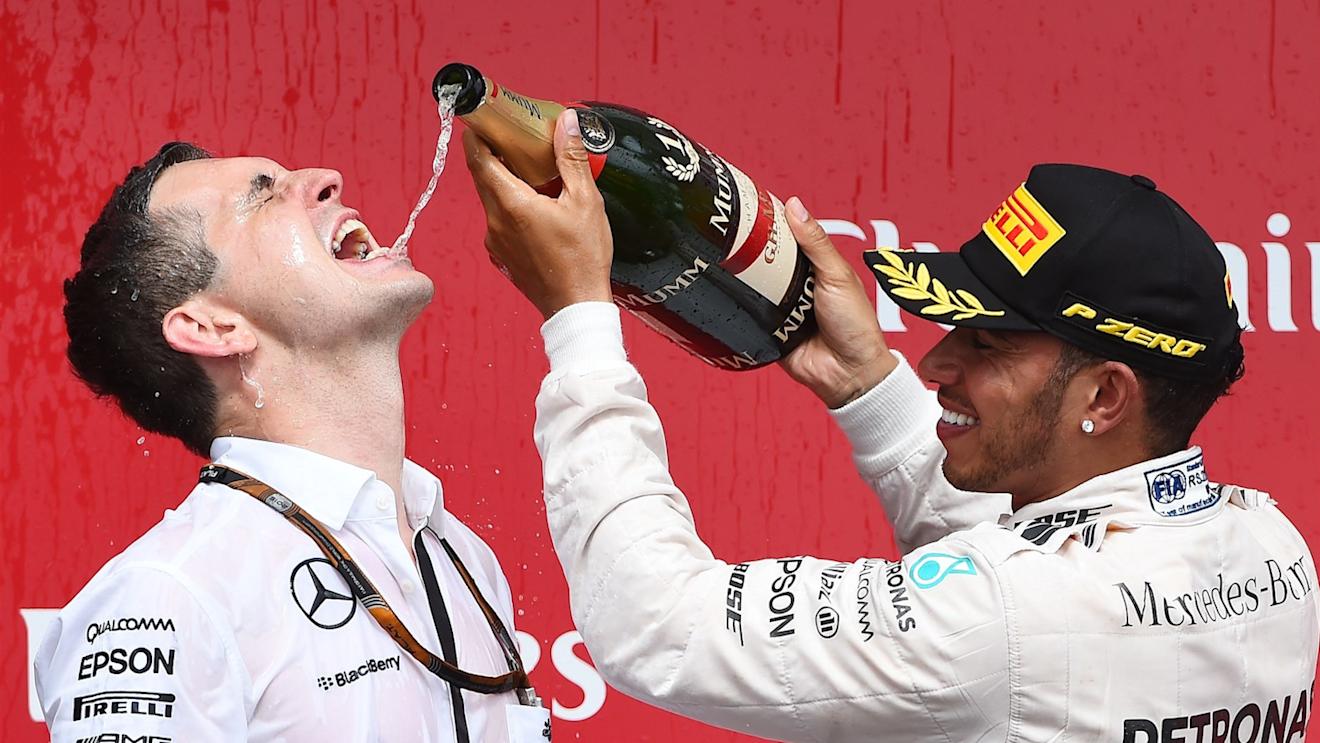 Race winner Lewis Hamilton (GBR) Mercedes AMG F1 celebrates with Riccardo Mosconi (ITA) Mercedes AMG F1 Data Engineer and the champagne on the podium at Formula One World Championship, Rd7, Canadian Grand Prix, Race, Montreal, Canada, Sunday 7 June 2015. © Sutton Motorsport Images