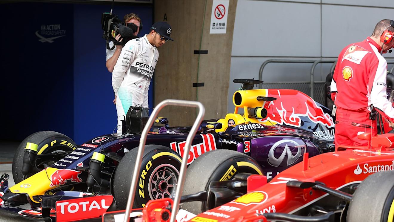 Pole sitter Lewis Hamilton (GBR) Mercedes AMG F1 looks at the Ferrari SF15-T in parc ferme at Formula One World Championship, Rd3, Chinese Grand Prix, Qualifying, Shanghai, China, Saturday 11 April 2015. © Sutton Motorsport Images