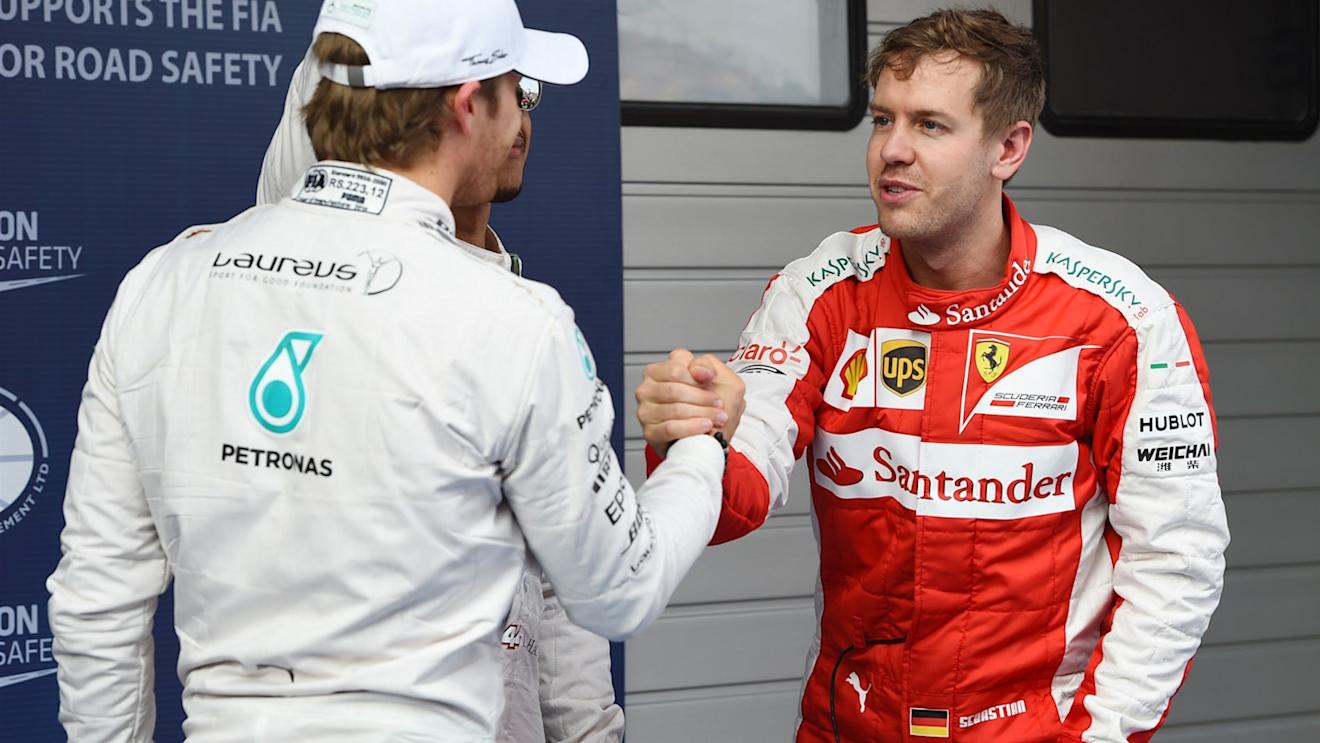 Nico Rosberg (GER) Mercedes AMG F1 shakes hands with Sebastian Vettel (GER) Ferrari in Parc Ferme at Formula One World Championship, Rd3, Chinese Grand Prix, Qualifying, Shanghai, China, Saturday 11 April 2015. © Sutton Motorsport Images