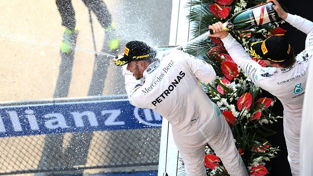 Lewis Hamilton (GBR) Mercedes AMG F1 and Nico Rosberg (GER) Mercedes AMG F1 celebrate with the champagne on the podium at Formula One World Championship, Rd3, Chinese Grand Prix, Race, Shanghai, China, Sunday 12 April 2015. © Sutton Motorsport Images