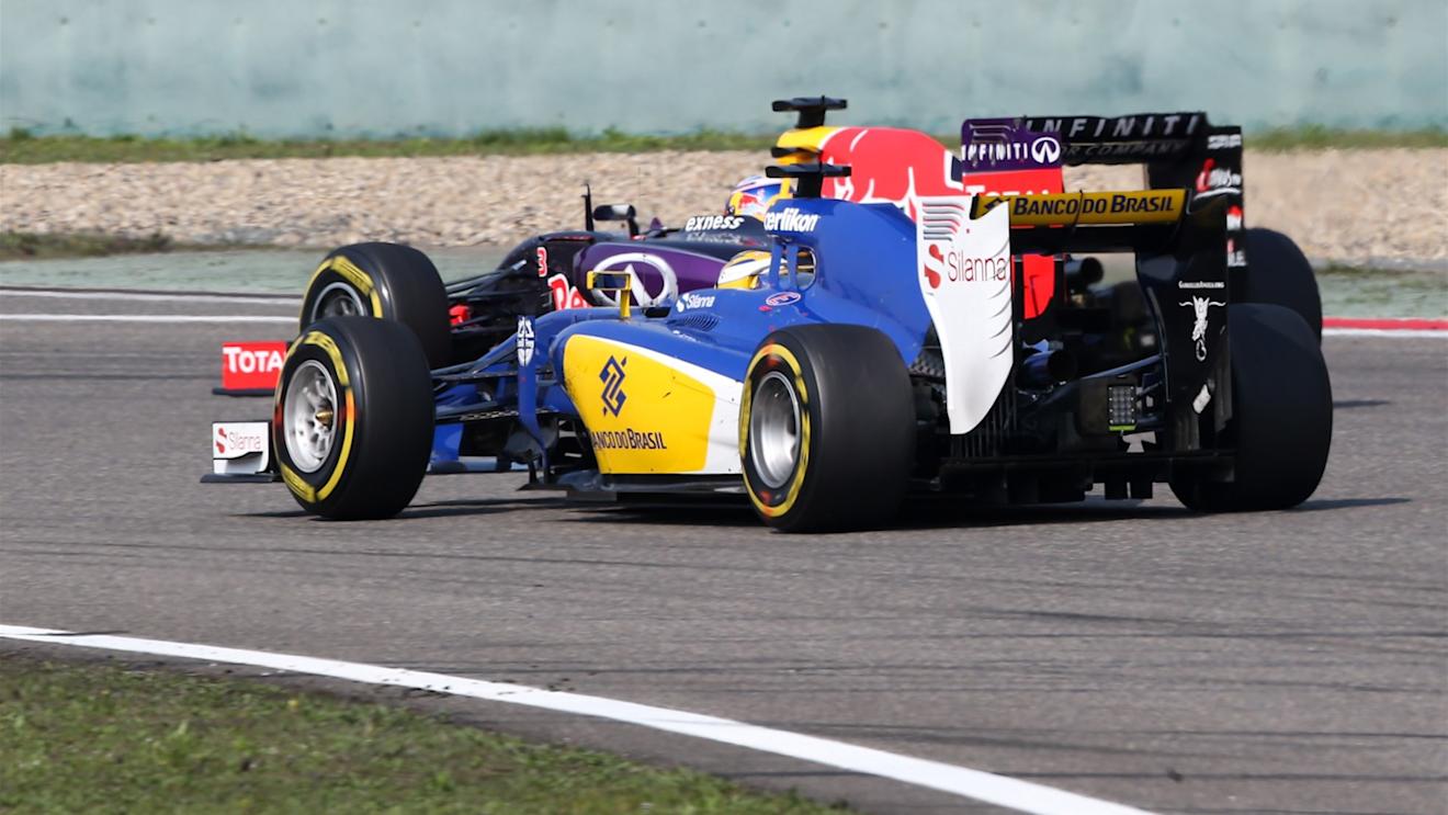 Daniel Ricciardo (AUS) Red Bull Racing RB11 and Marcus Ericsson (SWE) Sauber C34 battle at Formula One World Championship, Rd3, Chinese Grand Prix, Race, Shanghai, China, Sunday 12 April 2015. © Sutton Motorsport Images